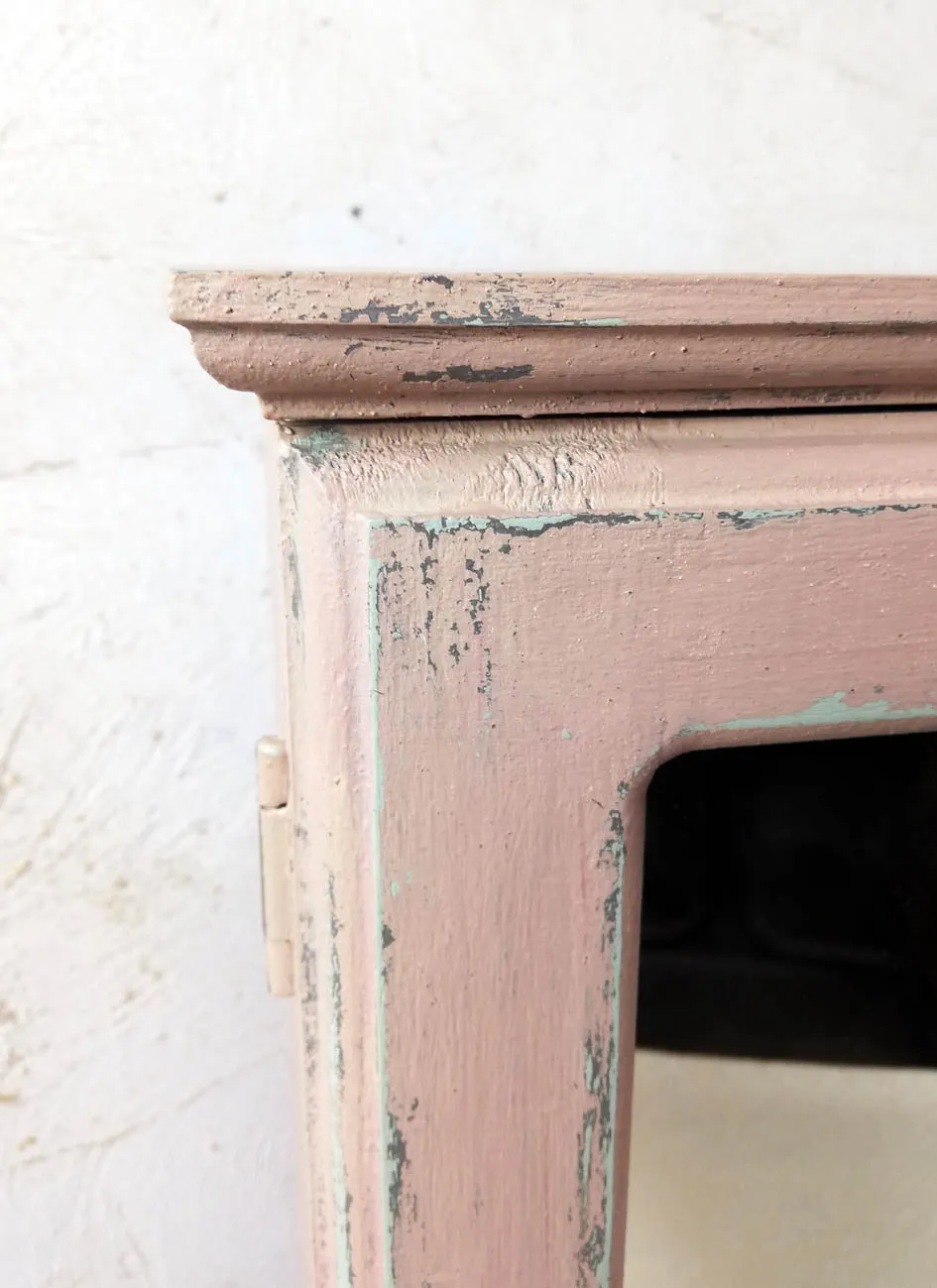 Vintage bathroom cabinet painted in soft pink
