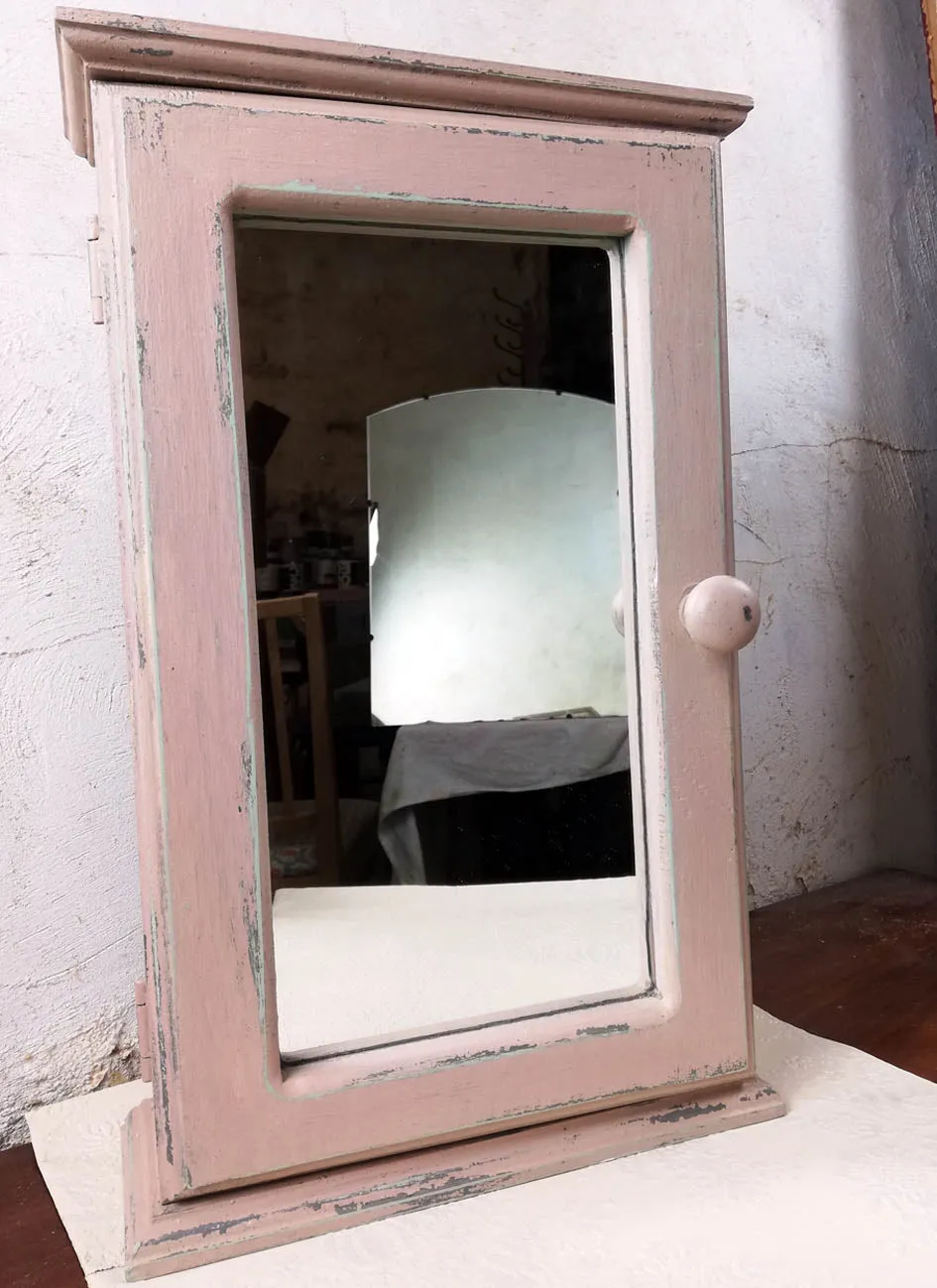 Vintage bathroom cabinet painted in soft pink
