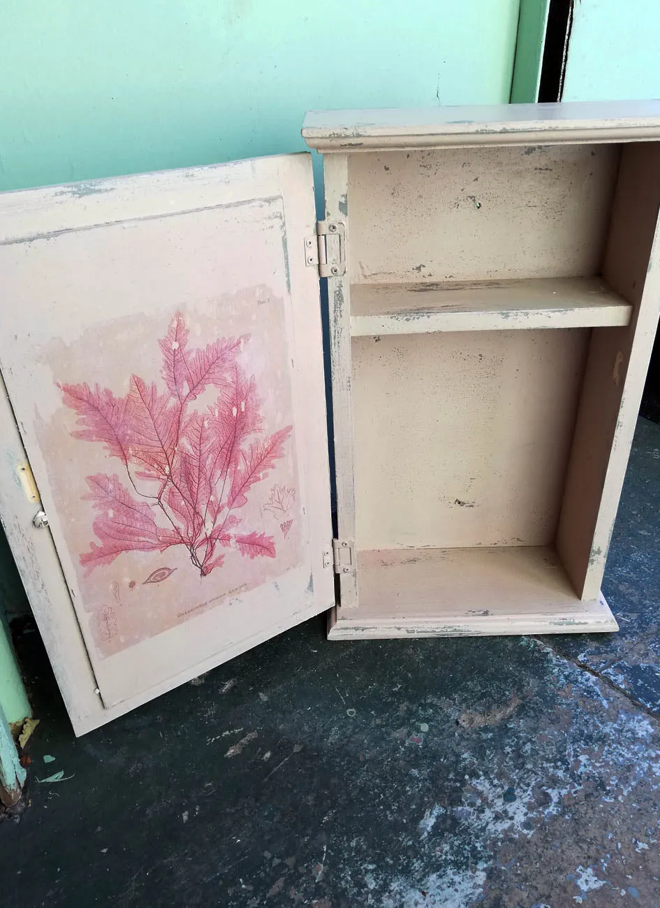 Vintage bathroom cabinet painted in soft pink